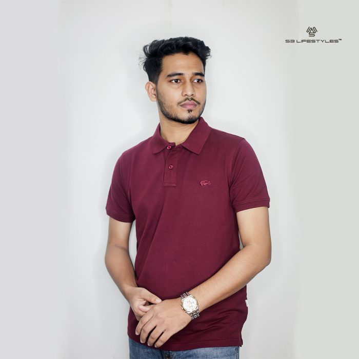 Man and woman wearing black and beige polo t-shirts from S3 Lifestyles